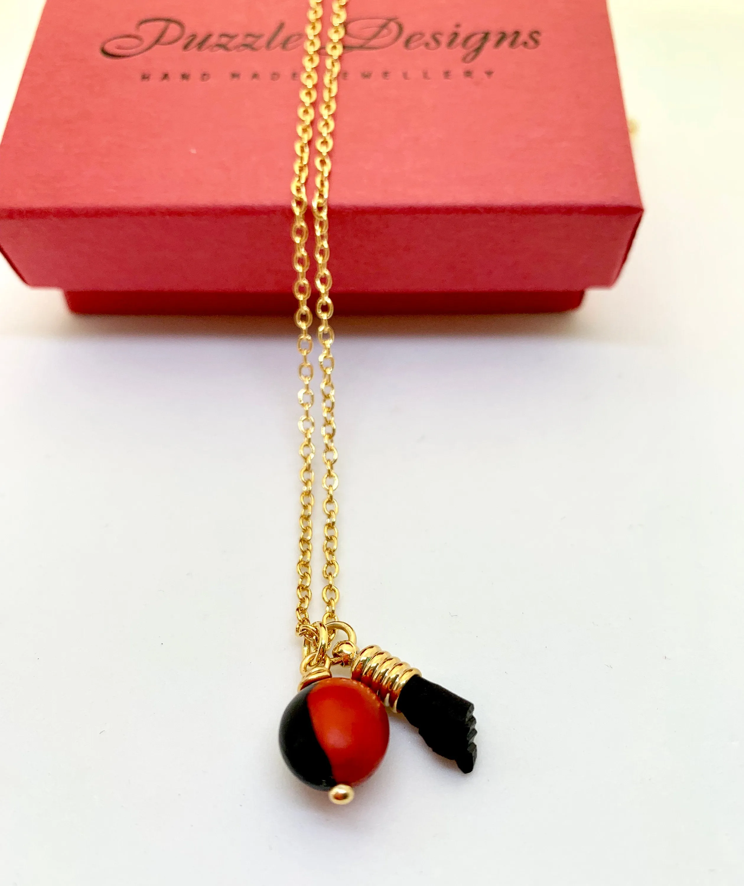 Azabache, Peonia and ojo de buey necklace